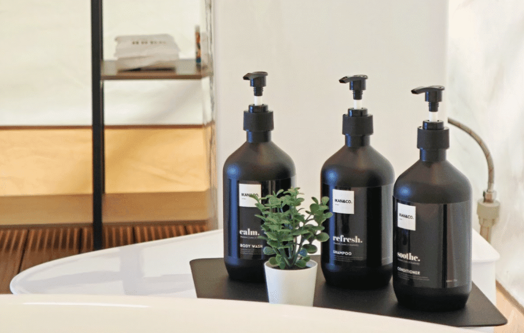 Premium bath products and sustainable toiletries in a luxury tent bathroom at IKAN Glampsite, highlighting personal care must-haves for glamping in Malaysia.